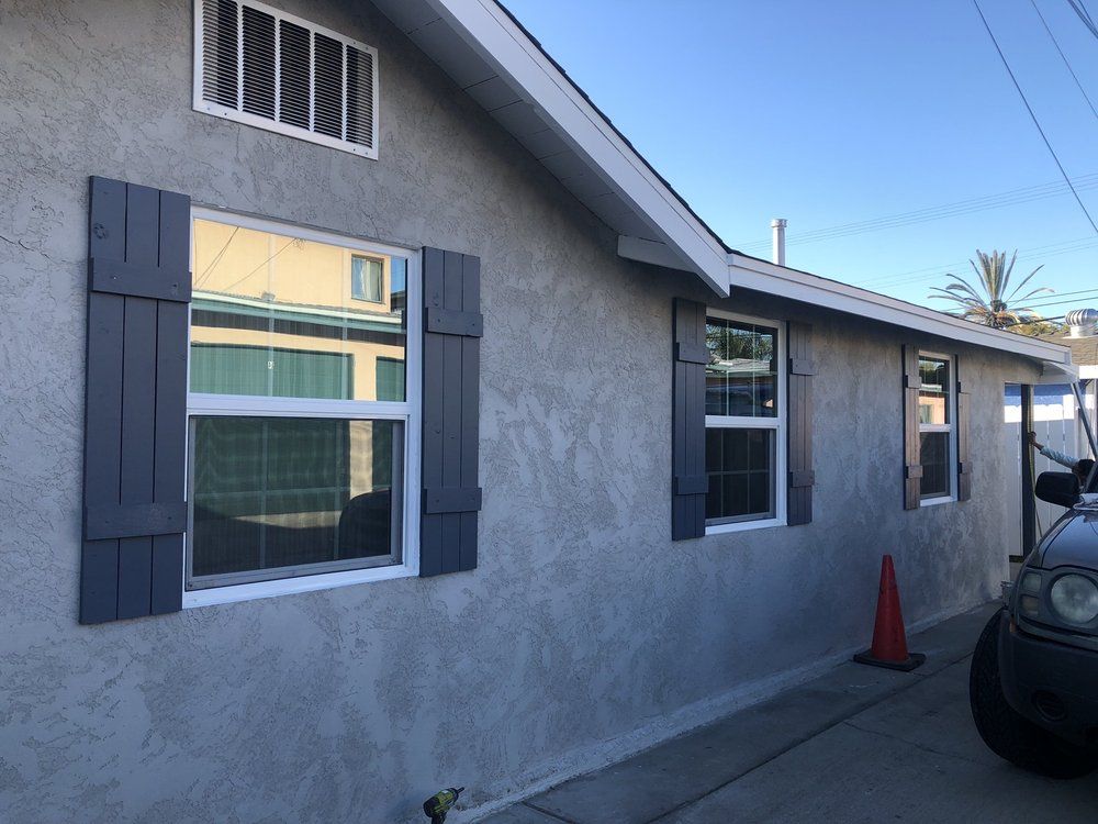 A house with a golf cart parked in front of it