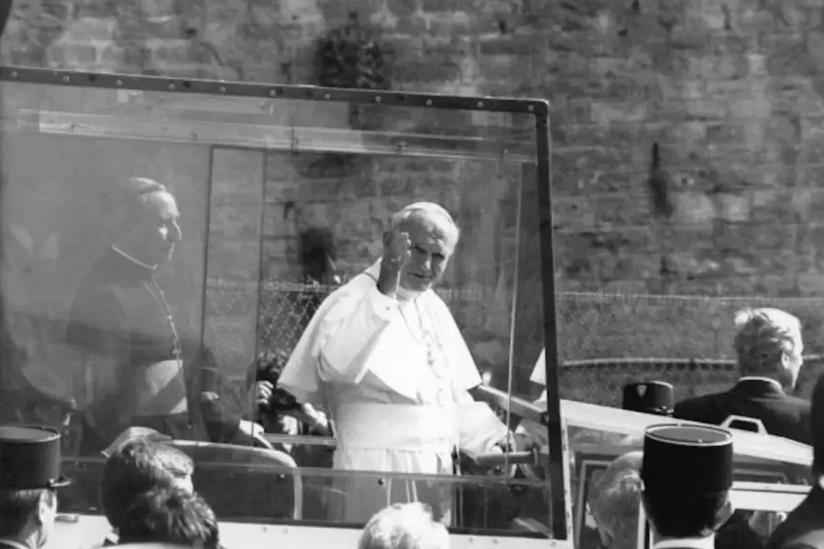 Pope John Paul II waving from the Popemobile during his 1986 visit to Lyon
