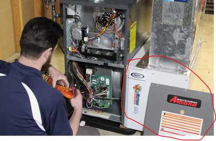 HVAC technician servicing a furnace in Windsor Ontario