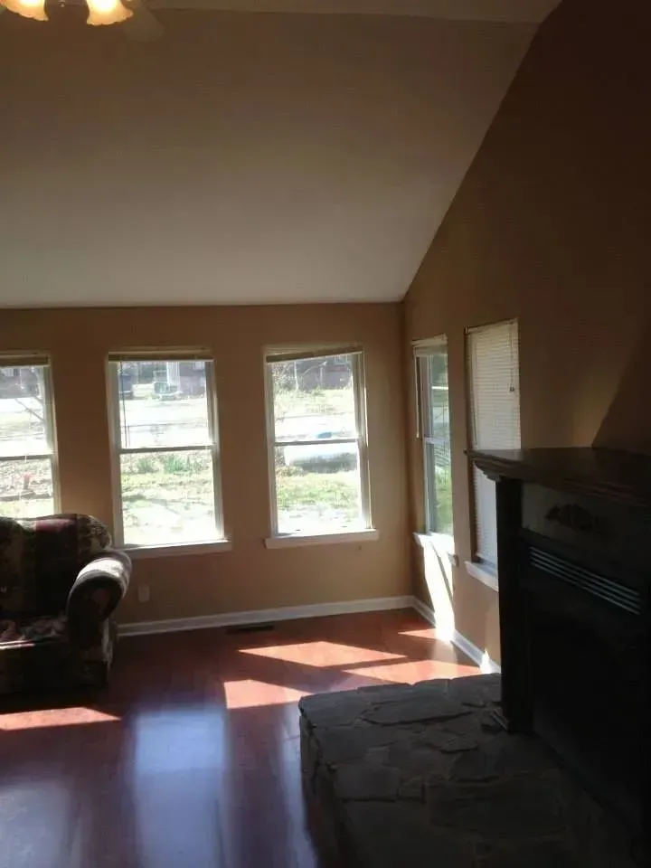 A living room with a fireplace and a couch