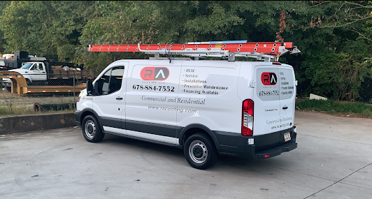 A white van with a red ladder on top of it is parked in a parking lot.