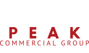 The peak commercial group logo is red and white on a white background.