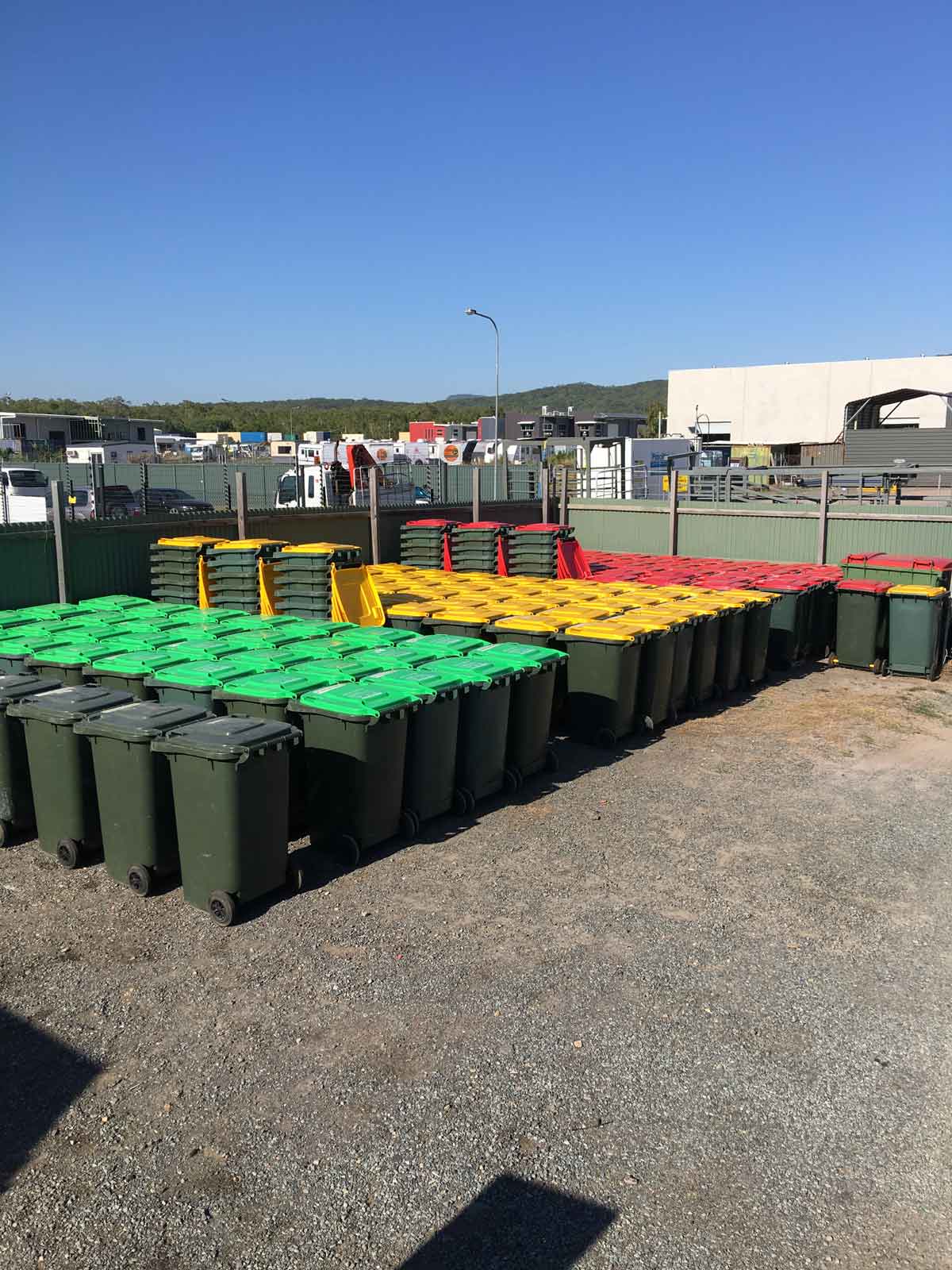 Large Collection of Green, Red & Yellow Bins — Waste Management in Sunshine Coast, QLD