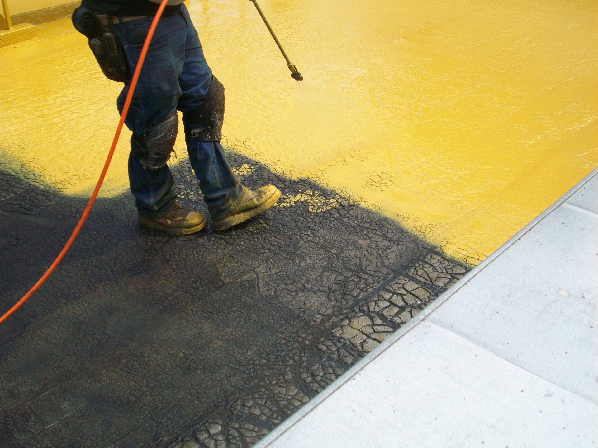 Combined fluid applied membrane (non breathable) with liquid applied roof coating.