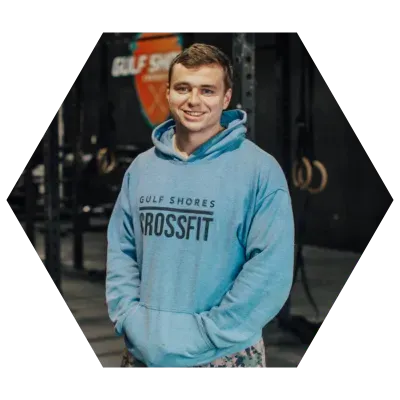 Man smiling, wearing a blue 