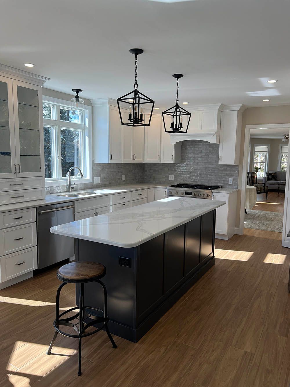 A kitchen with a large island in the middle of it.