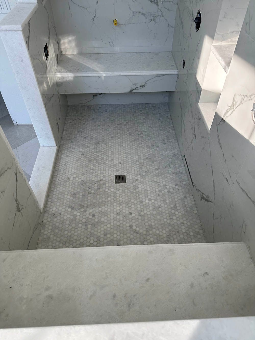 A bathroom with a bathtub and a shower stall.