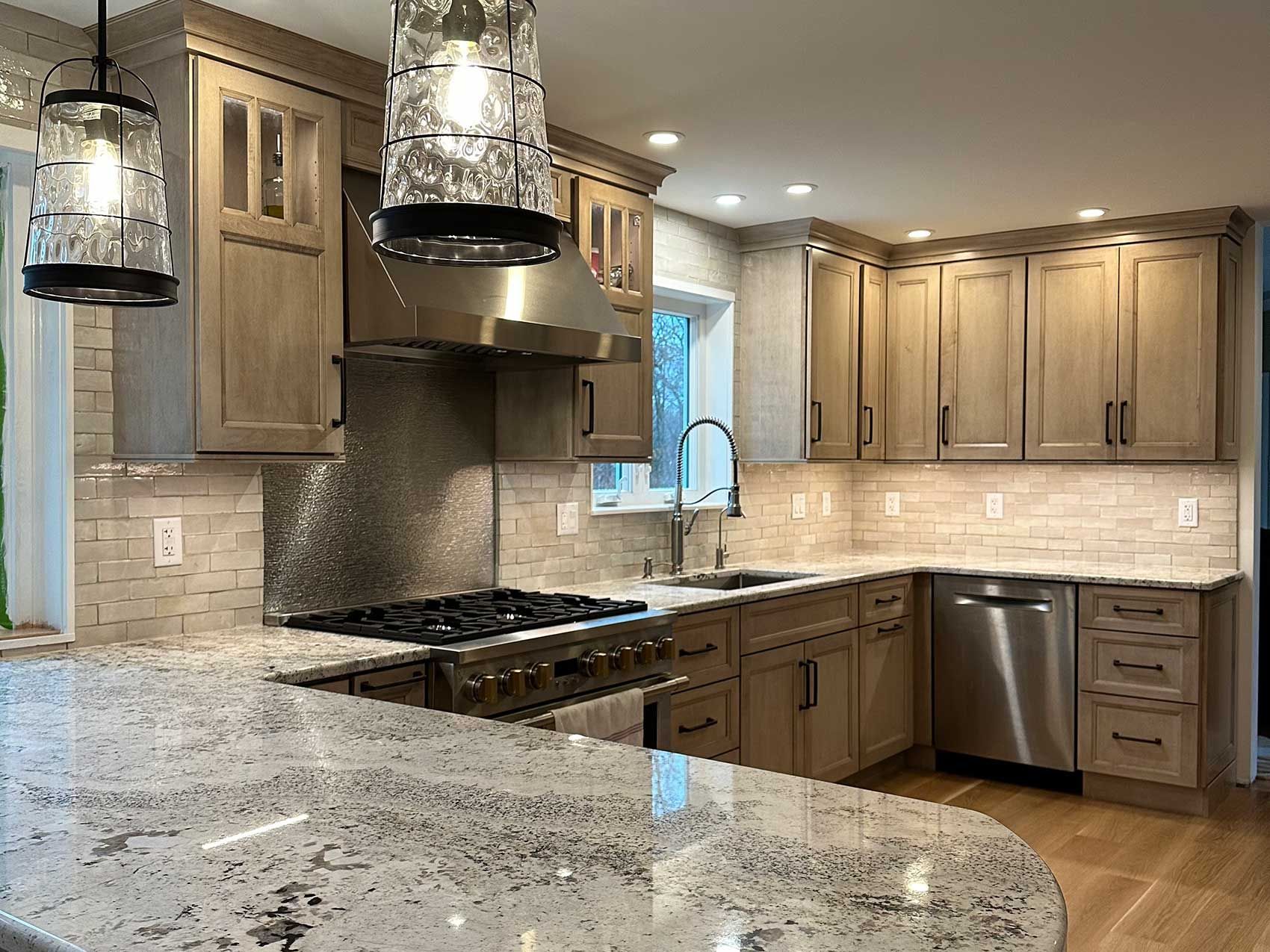 A kitchen with stainless steel appliances and granite counter tops
