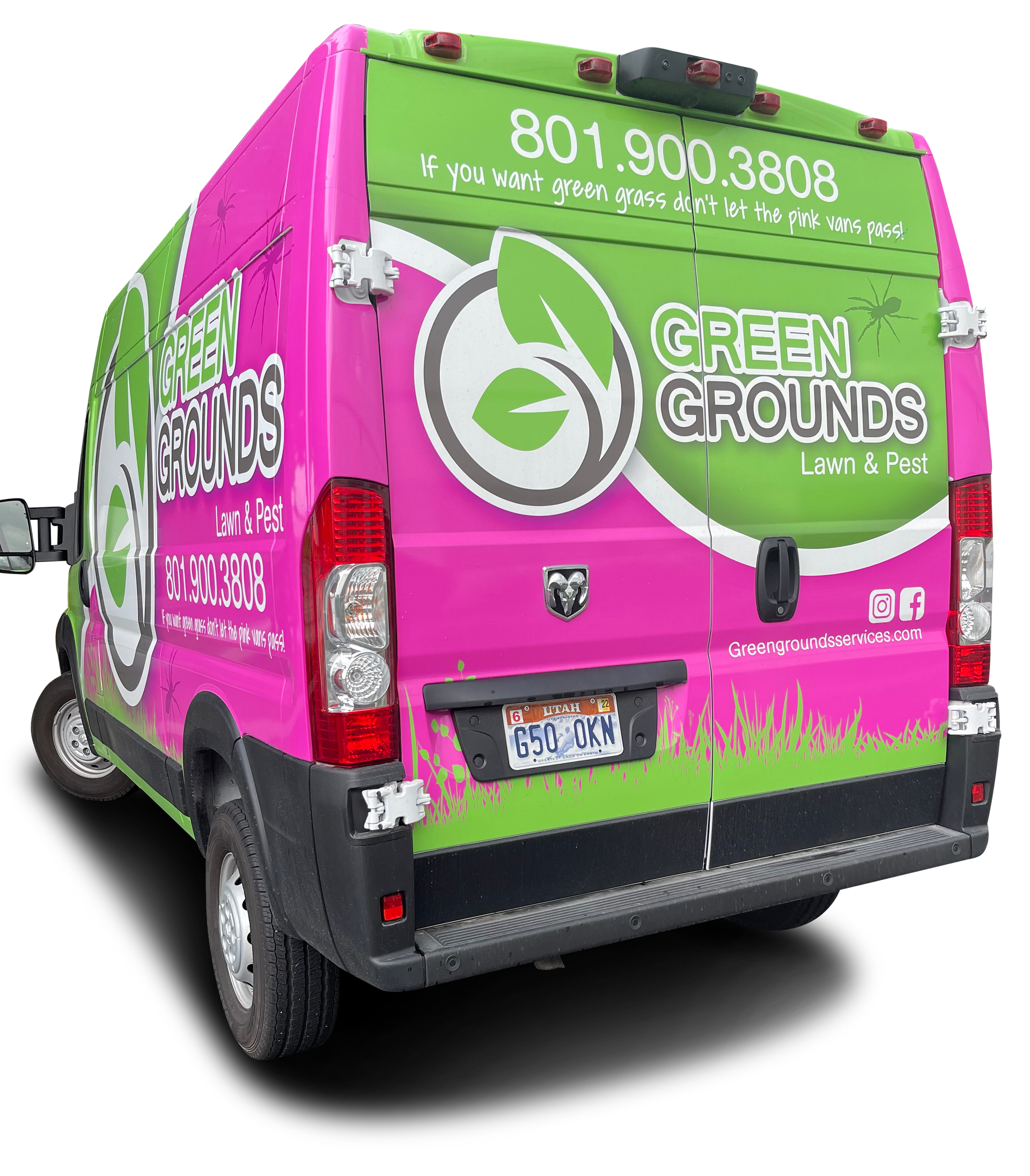 The back of a pink and green van that says green grounds