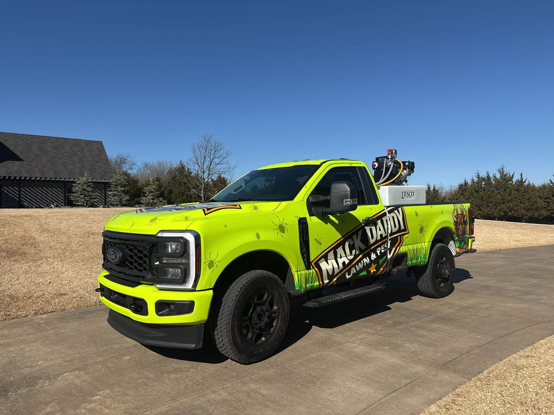 Bright yellow pickup truck with black wheels, 