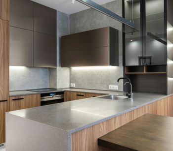 A kitchen with stainless steel appliances and wooden cabinets