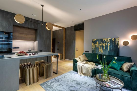 A living room with a green couch and a coffee table.