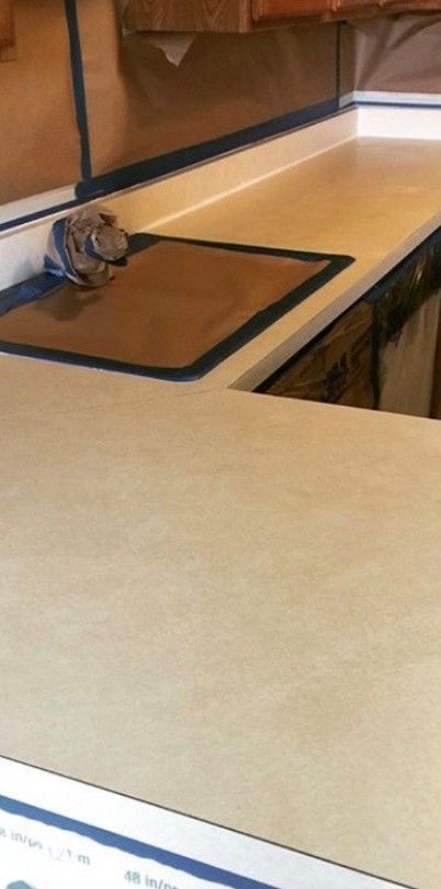 A kitchen counter with a stove top oven on it