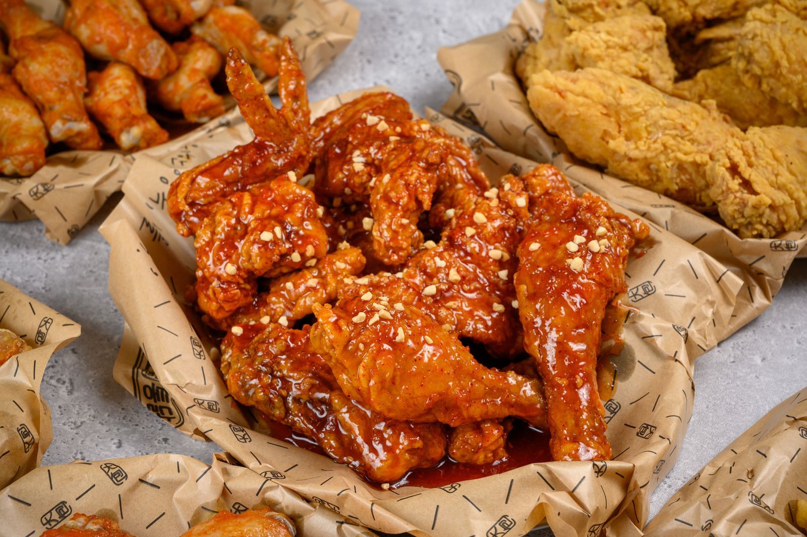 There are many different types of fried chicken on the table.