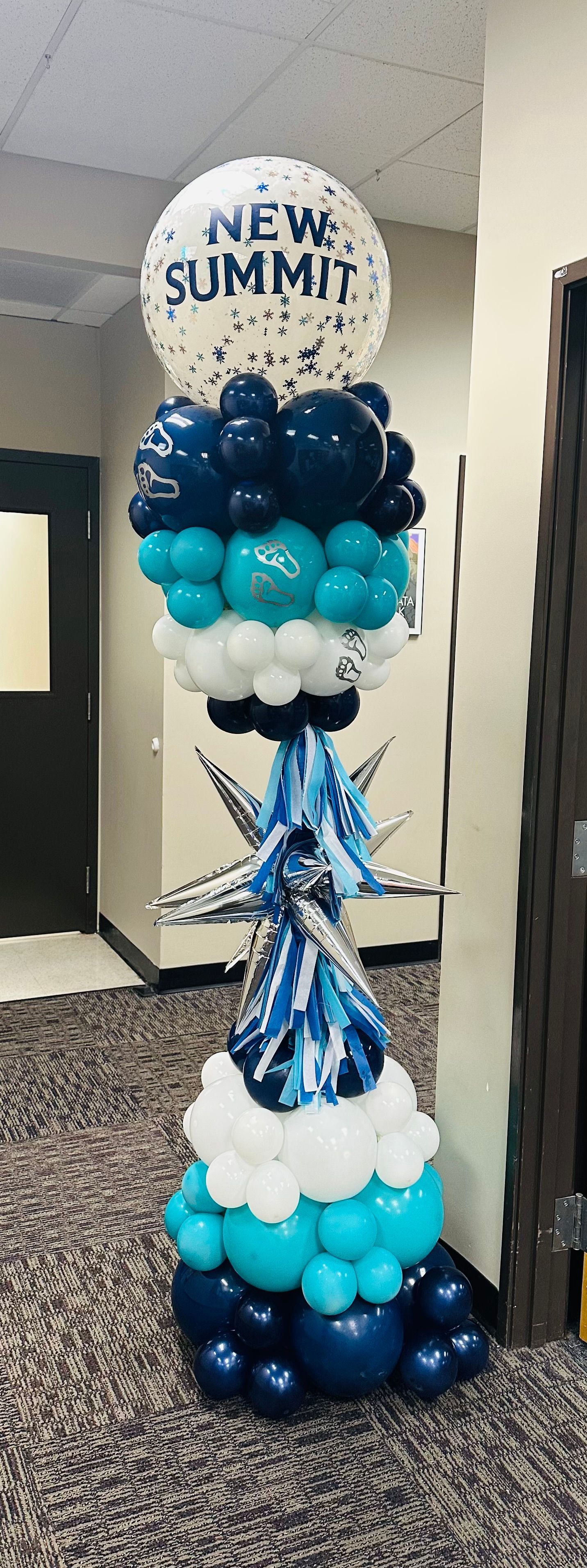 A tall balloon sculpture with 