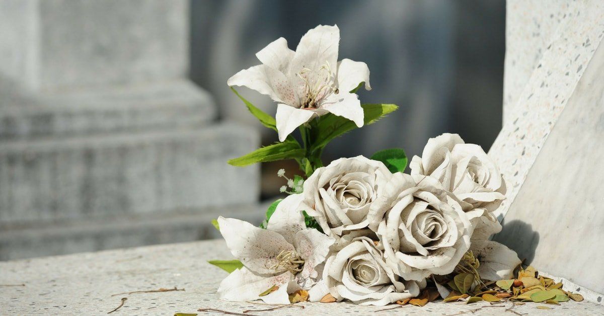 funeral service myths white flowers