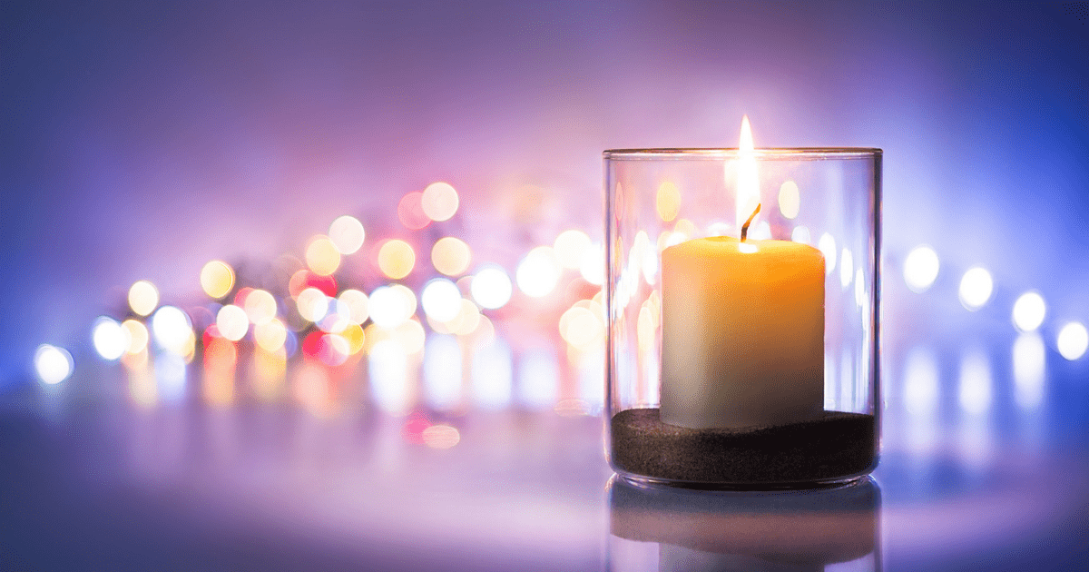 lit candles with purple background