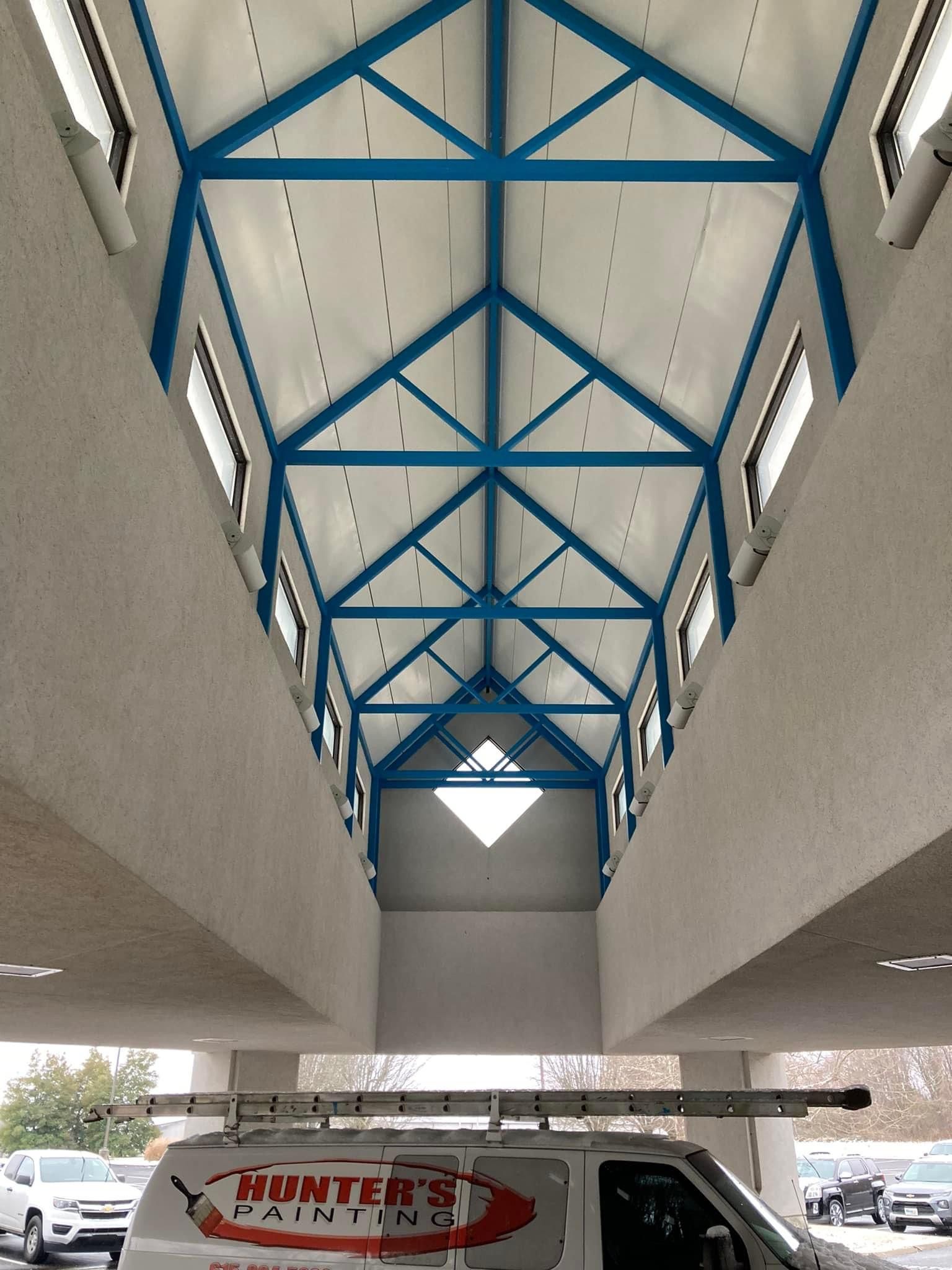 A white van with the word painting on it