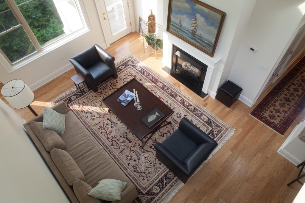 living room with rug and couches