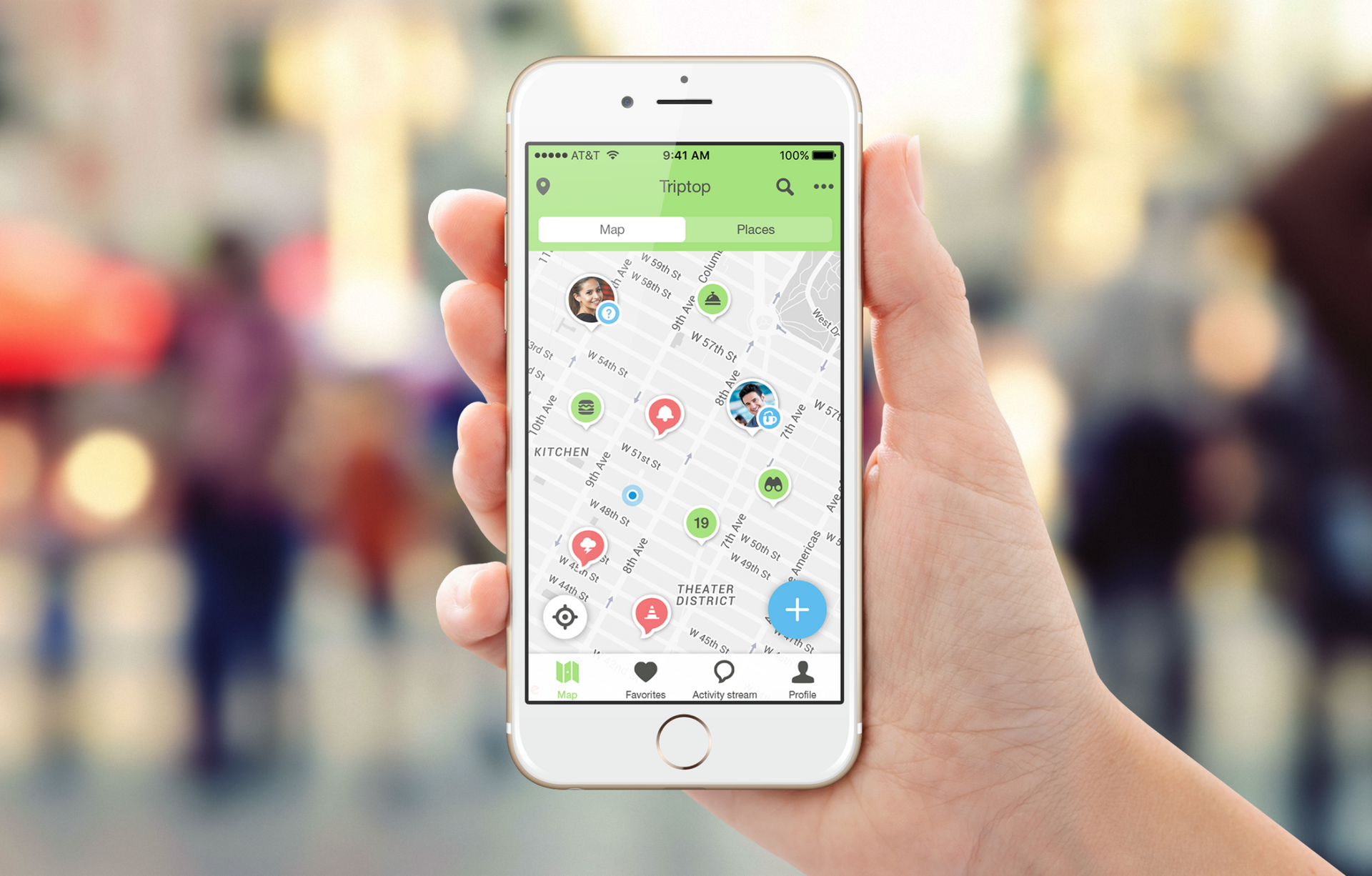 A person is holding a cell phone with a map on the screen.