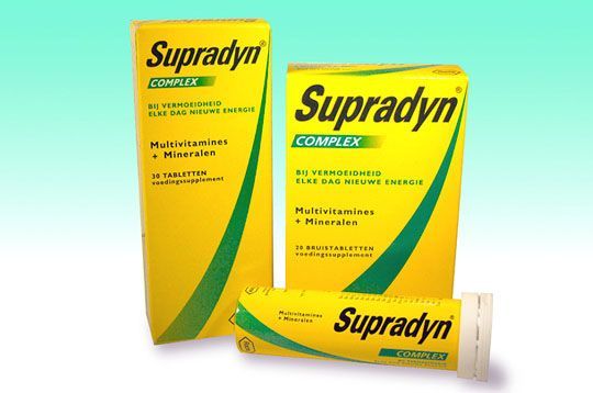 Three boxes of supradyn complex on a blue background