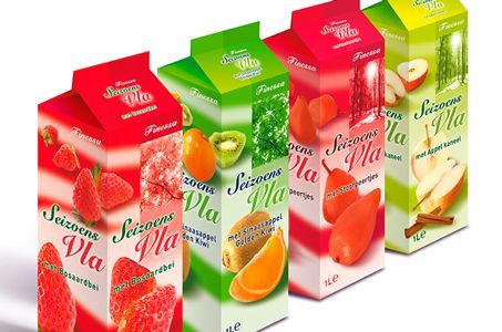 Four cartons of juice with different fruits on them