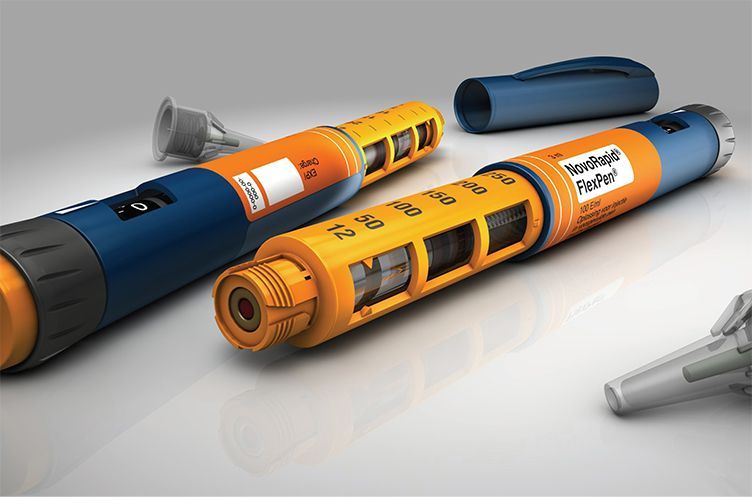 Two insulin pens are sitting next to each other on a table