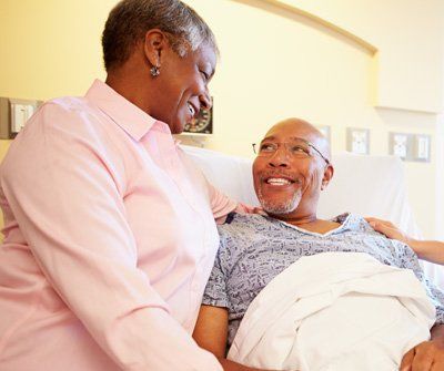 Senior Couple In Hospital Room