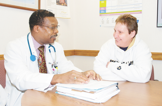 Dr. Richardo Carter meeting with patient