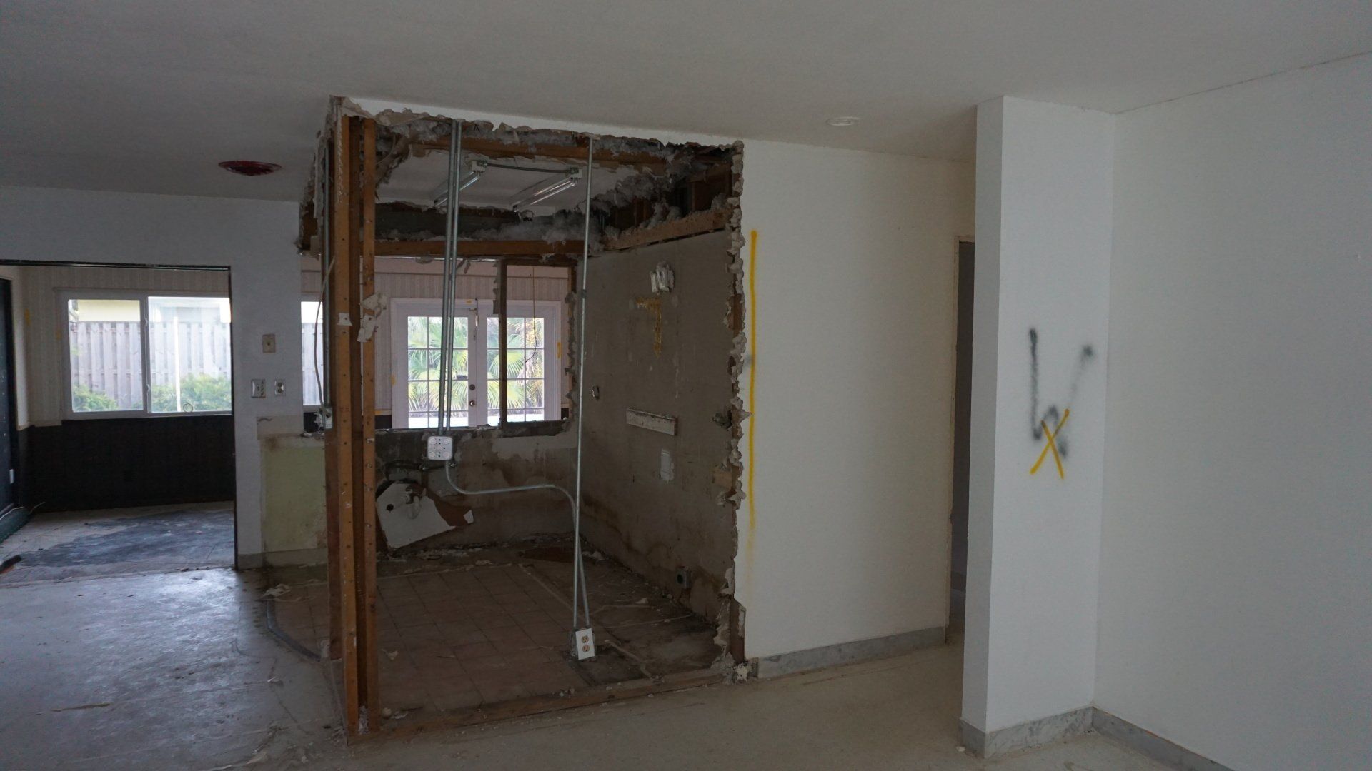 Demolishing outdated kitchen in old home.