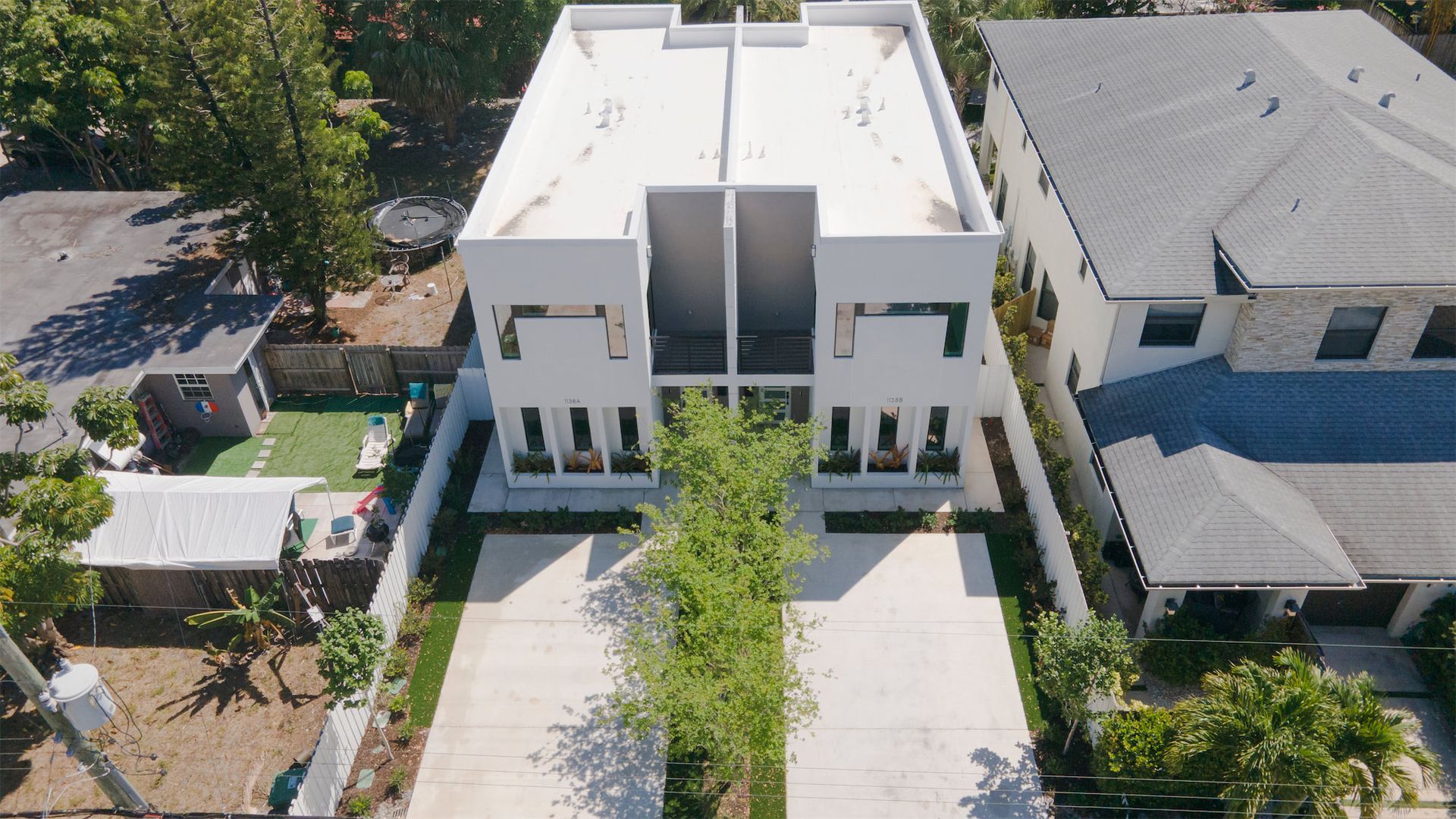 an aerial view of a house with a lot of windows
