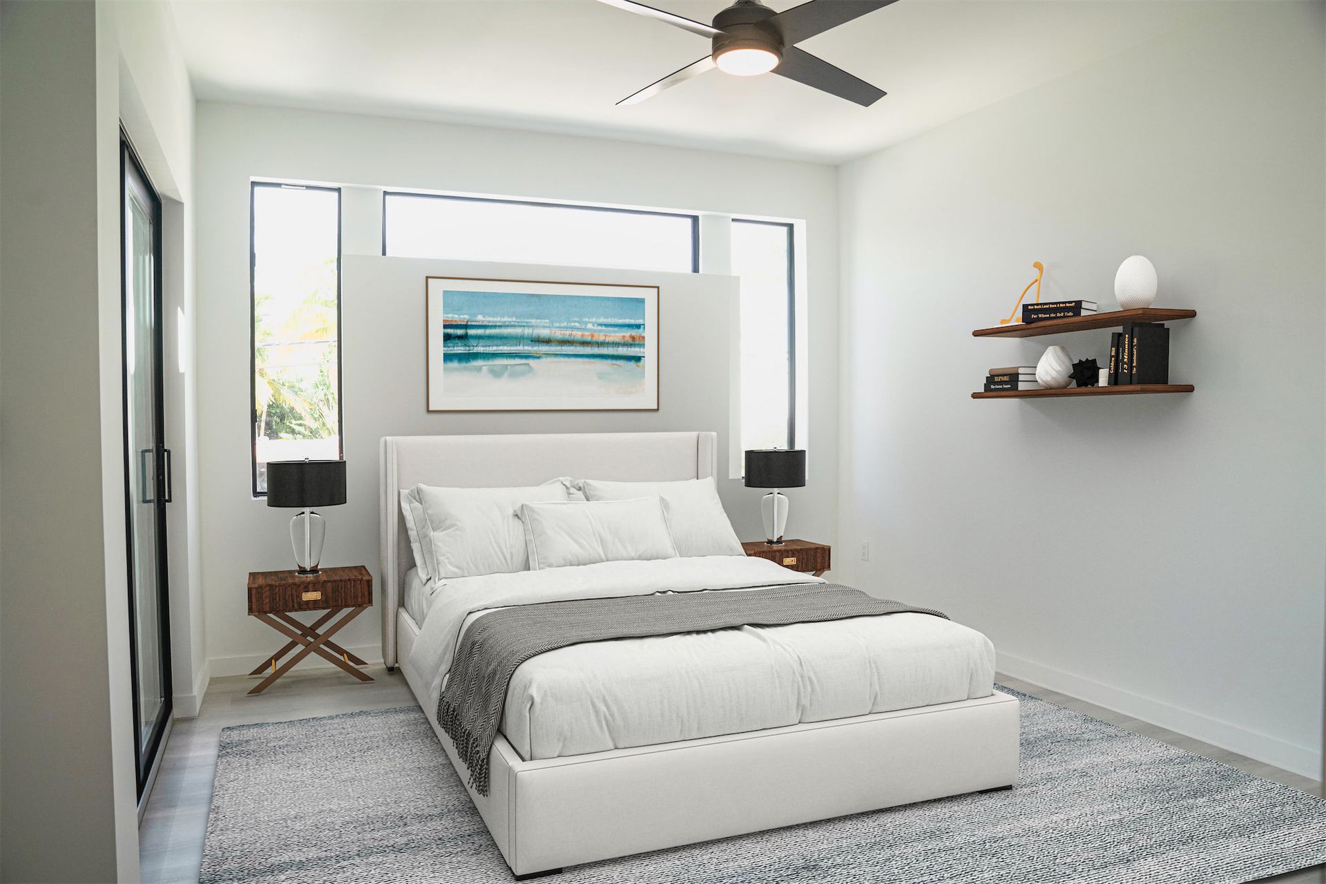 a bedroom with a large bed and a ceiling fan .