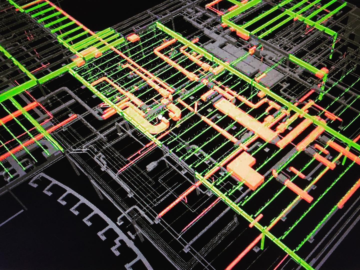 a computer generated image of a building with green and orange pipes .