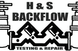 The logo for backflow testing and repair llc has a green arrow pointing to the right.