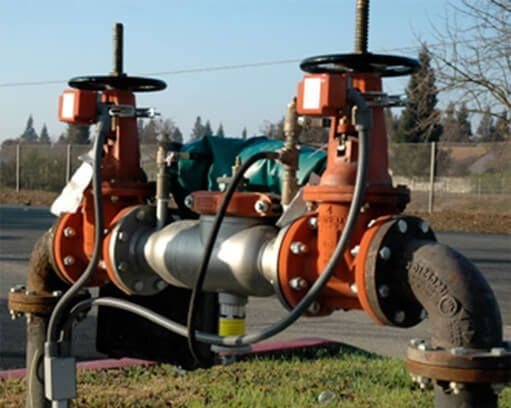 A couple of pipes with one that says ' stainless steel ' on it