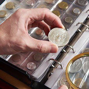 American dollar in hands of numismatist - Coin collection in Derry, New Hampshire