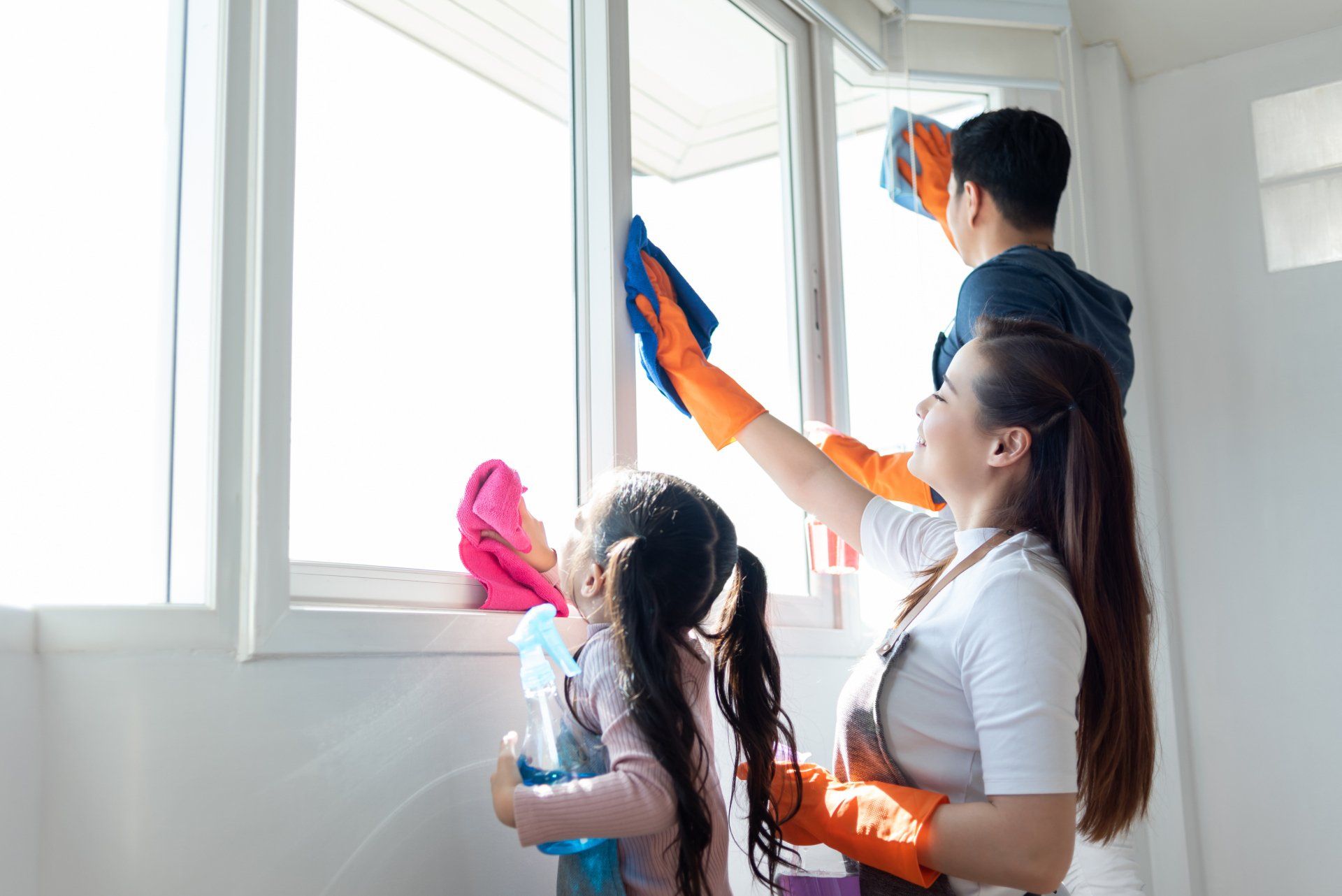 girl cleaning window