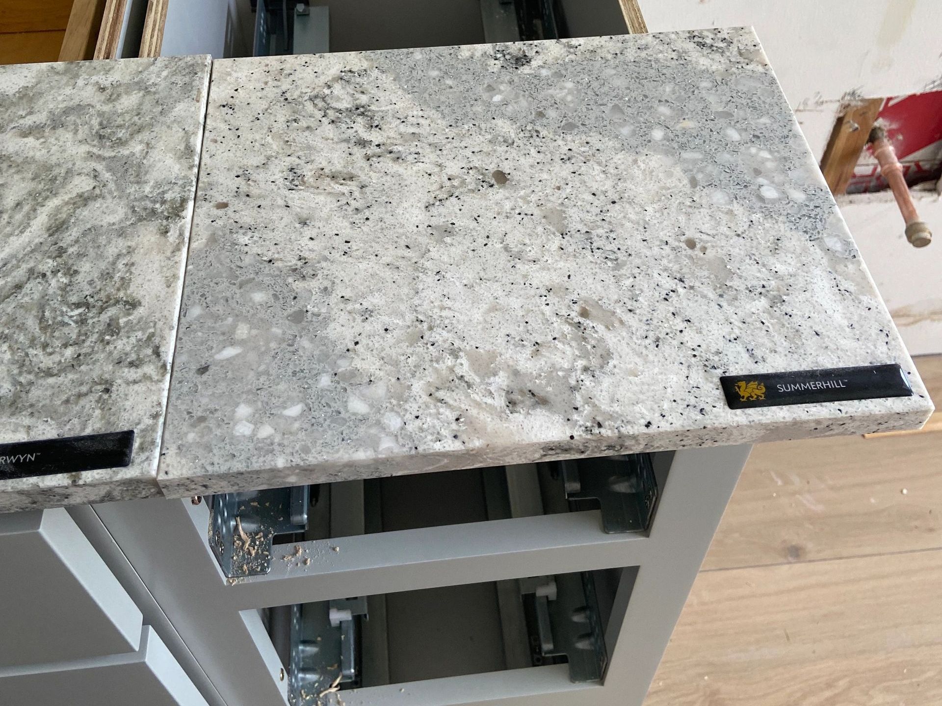 A close up of a granite counter top in a kitchen. A close up of a granite counter top in a kitchen.