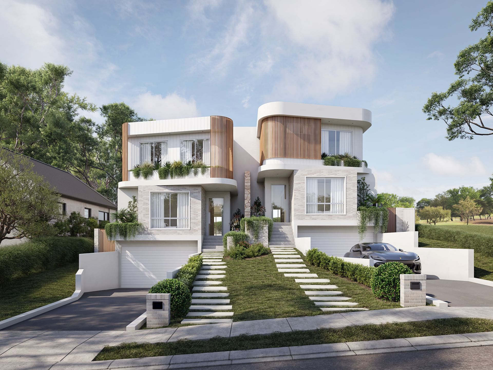 Two modern, white duplex homes with greenery, sunny day. Driveways and steps lead up to entrances — Gracia Building Design In Kiama, NSW
