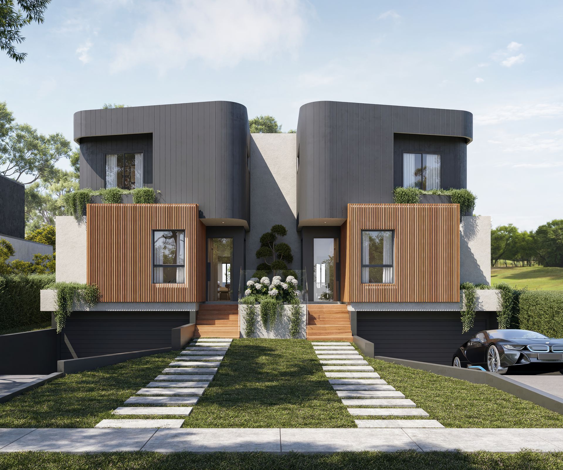 Modern gray and wood duplex with manicured landscaping, driveway, and car parked on the side — Gracia Building Design In Kiama, NSW