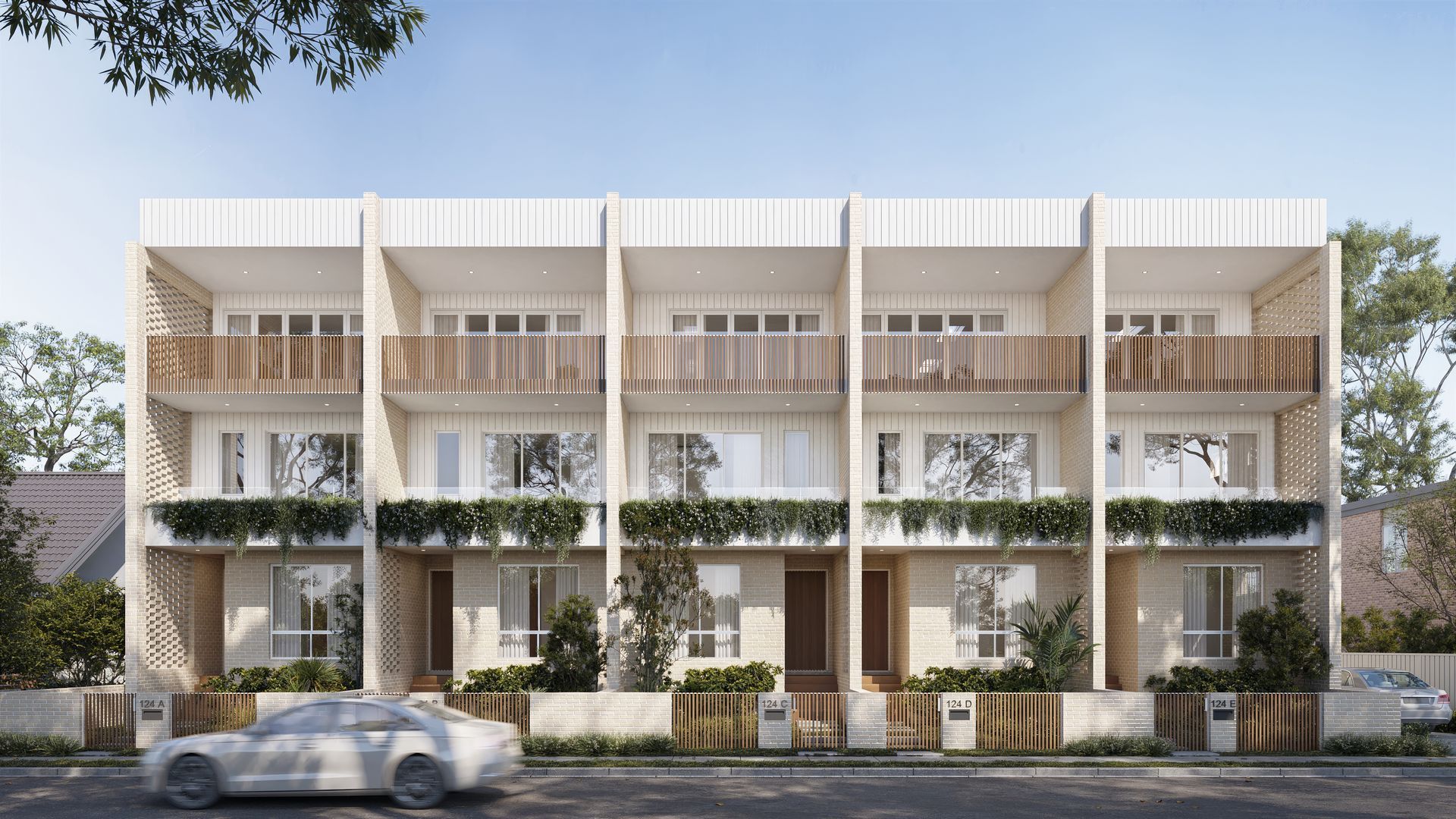 Modern row houses with light-coloured facade, balconies, and landscaped front yards — Gracia Building Design In Kiama, NSW