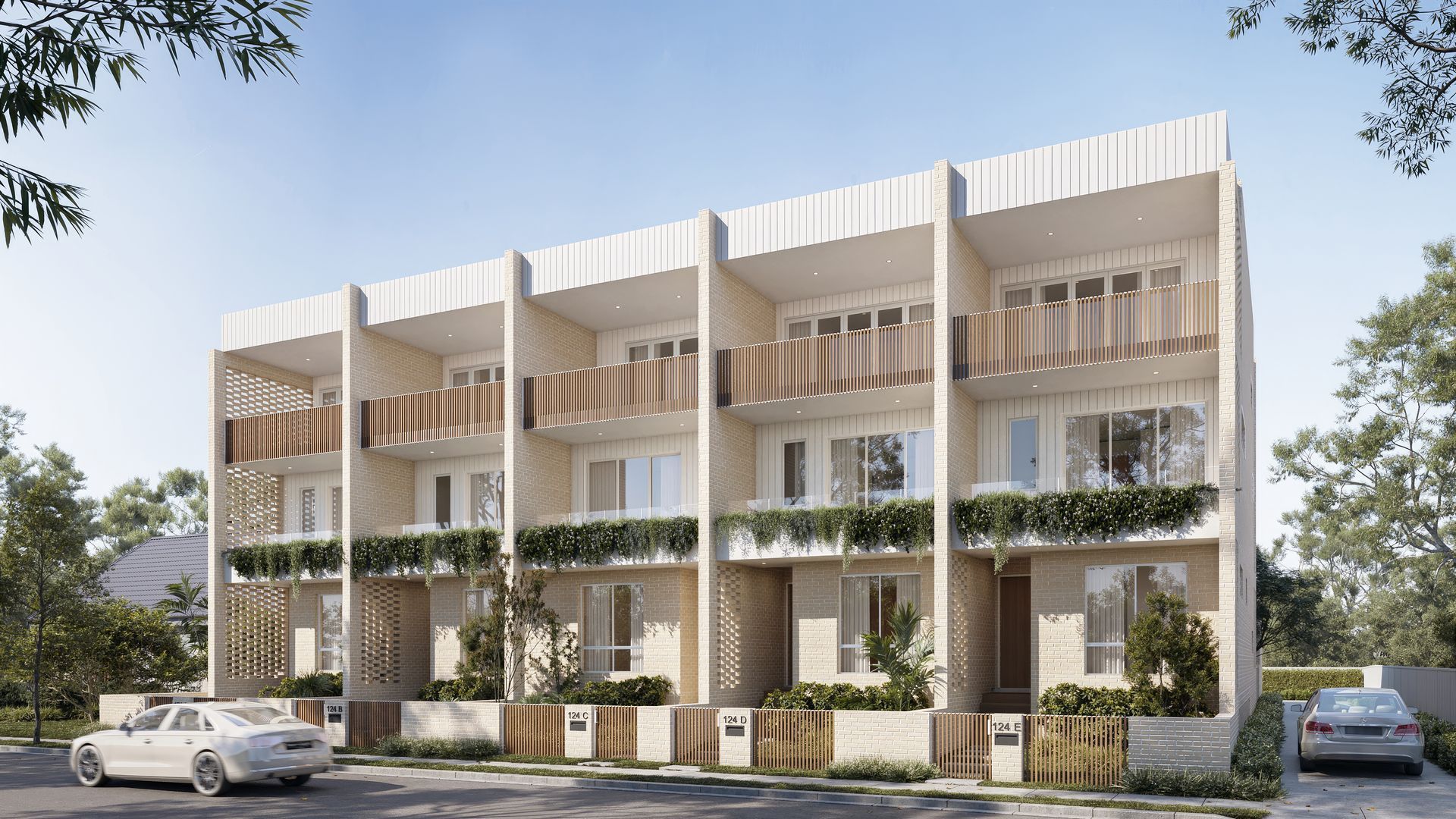 Modern townhouses with balconies and landscaping, under a clear sky — Gracia Building Design In Kiama, NSW