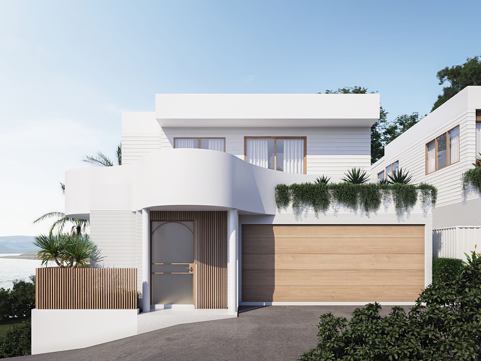 White modern home with light wood garage door and accents; coastal setting — Gracia Building Design In Kiama, NSW
