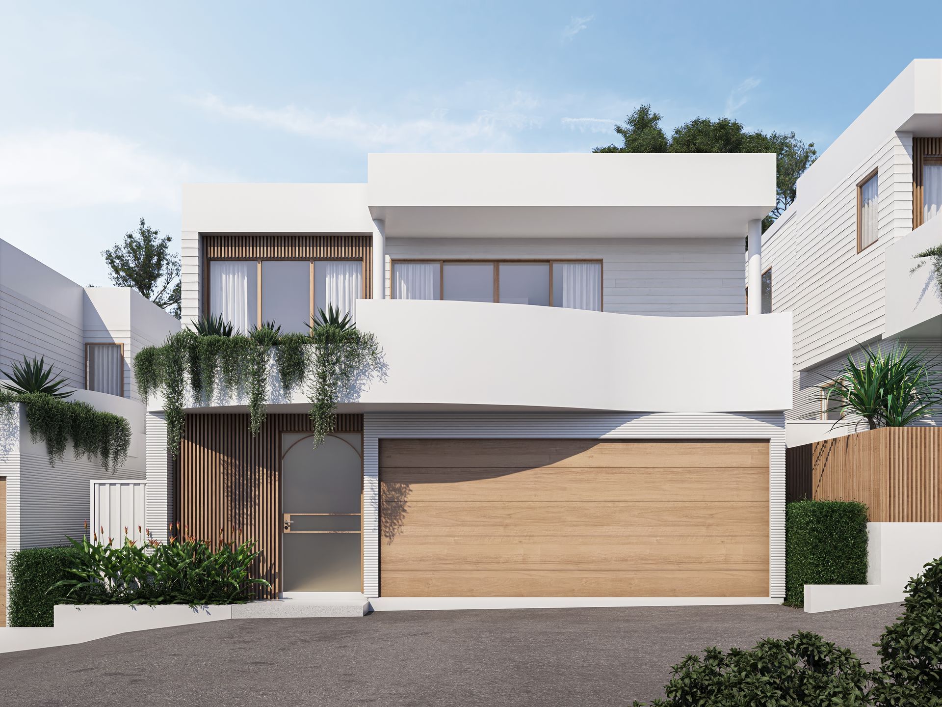 Two-story modern white house with a wooden garage door and balcony. Green plants adorn the facade — Gracia Building Design In Kiama, NSW