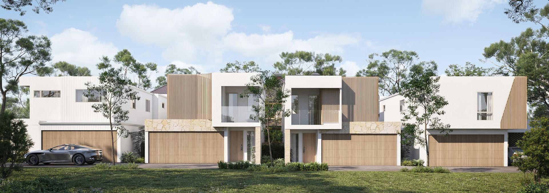 Modern Townhouses With Wooden Garage Doors, White Walls, and Surrounding Greenery. a Car is Parked in a Garage — Gracia Building Design In Kiama, NSW