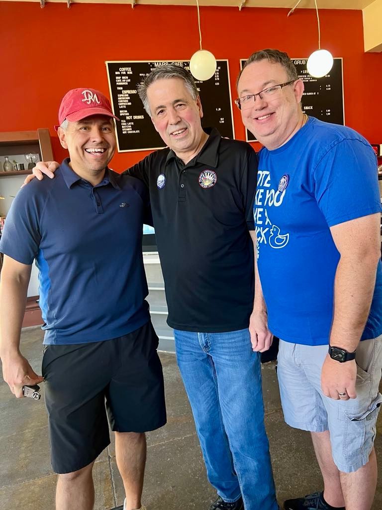 Rob Barron, Mitch Henry, and Larry McBurney posing at a canvassing event.