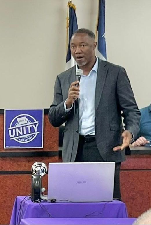 Armel Traore Dit Nignan, member of the Waukee School Board, speaks to members of the Iowa Unity Coalition