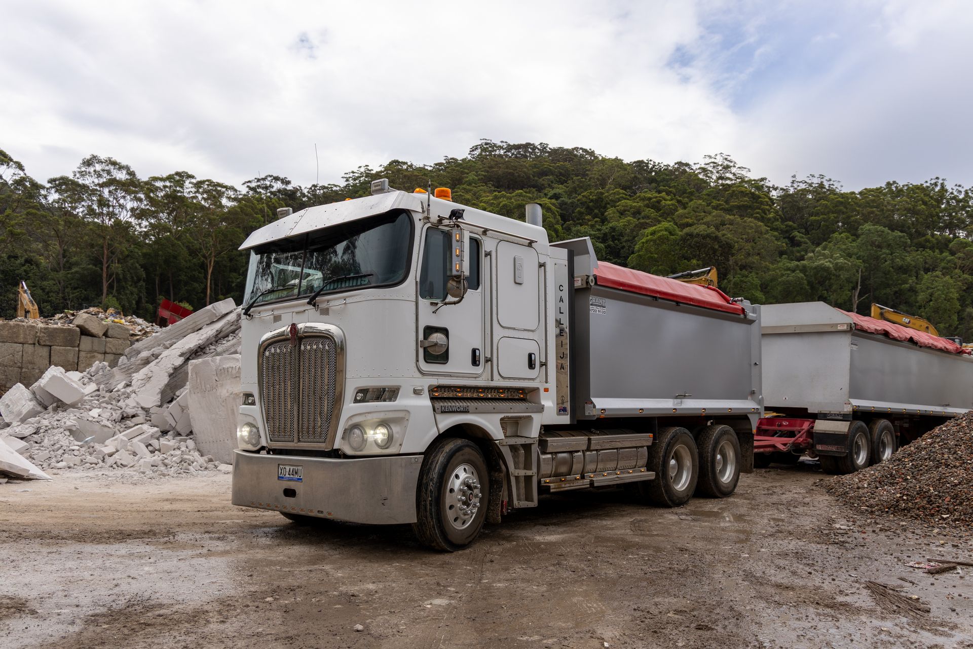 A Red and White Isuzu Truck — Economy Waste Group | Skip Bins Central Coast In West Gosford, NSW