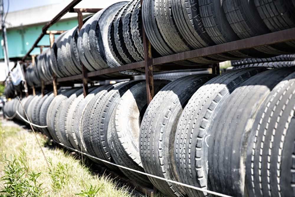 A Row of Tyres Are Stacked on Top of Each Other on a Shelf — Innisfail Pro Motors In Innisfail, QLD