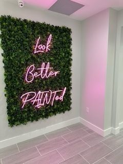 Green wall with neon sign: 